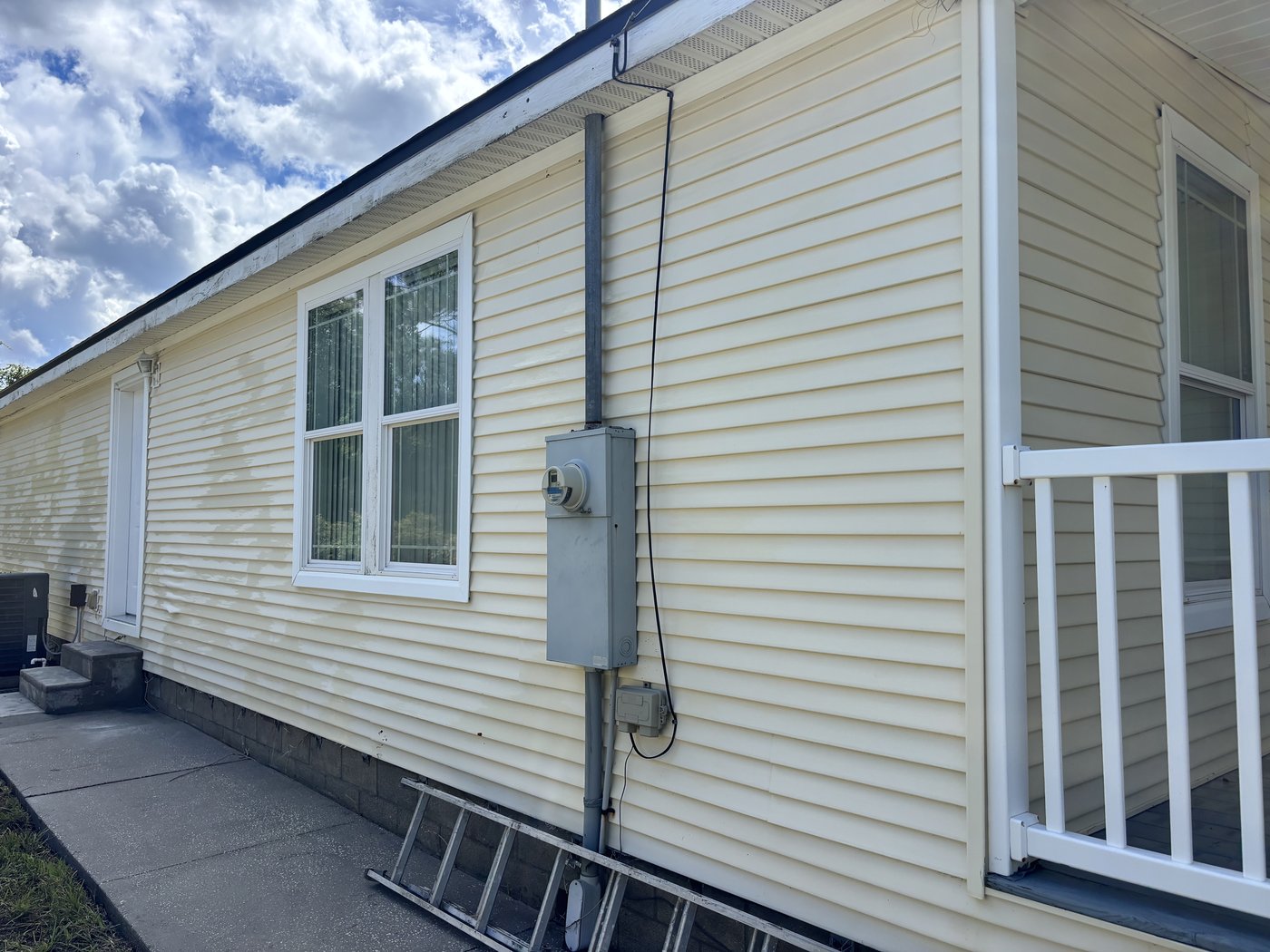 Same siding after soft washing, restored to like-new condition