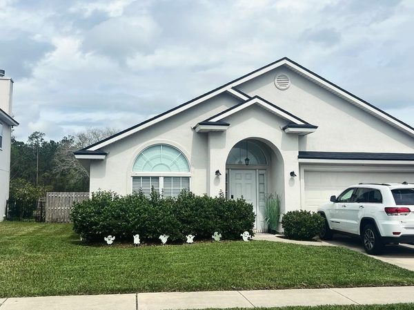 Trimmed hedges and healthy lawn