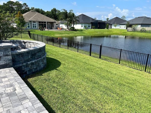 Backyard lawn care near pond